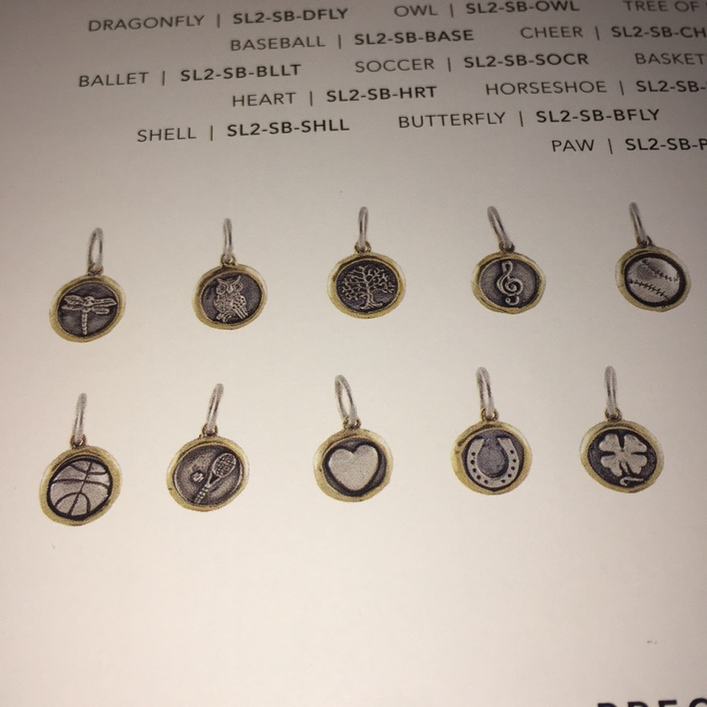 Real sterling silver and brass charms.